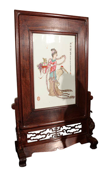 A fine decorated with painted porcelain with wooden frame and stand