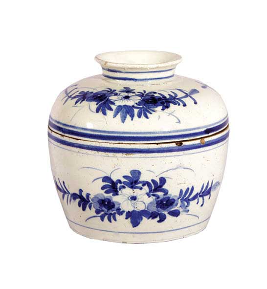 A blue and white jar with lid