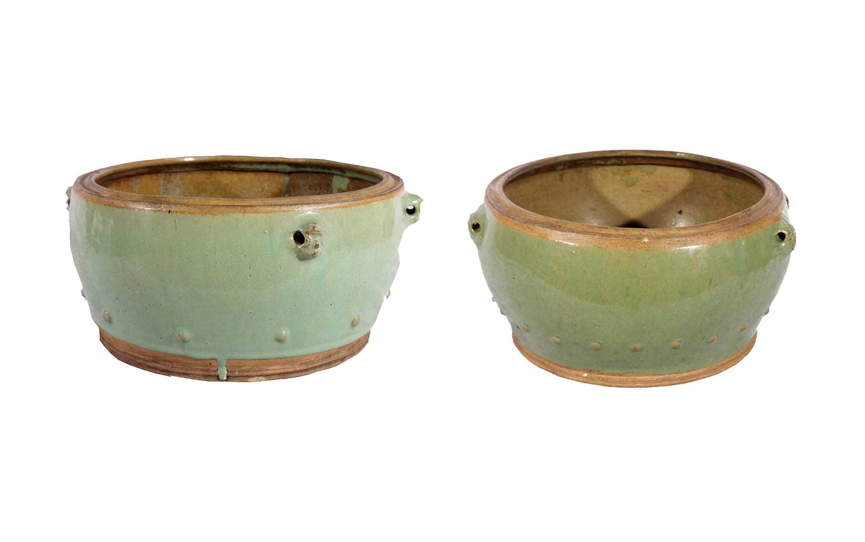 A set of two green-glazed bowls     