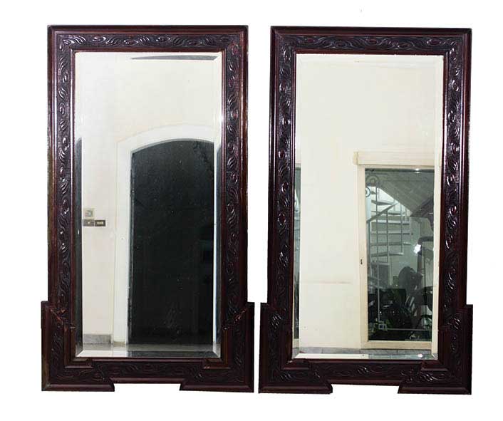 A set of two wooden framed mirrors