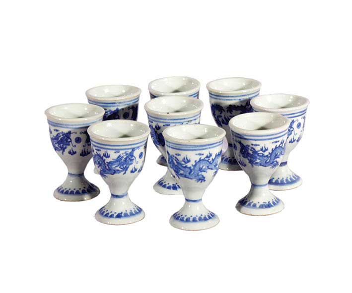 A set of ten blue and white arrack glasses with dragon decoration