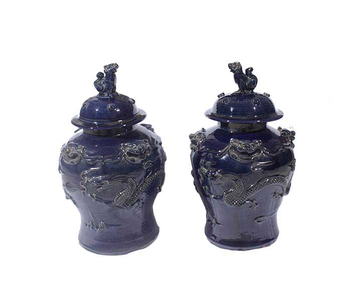 A pair of dark blue glazed covered jars