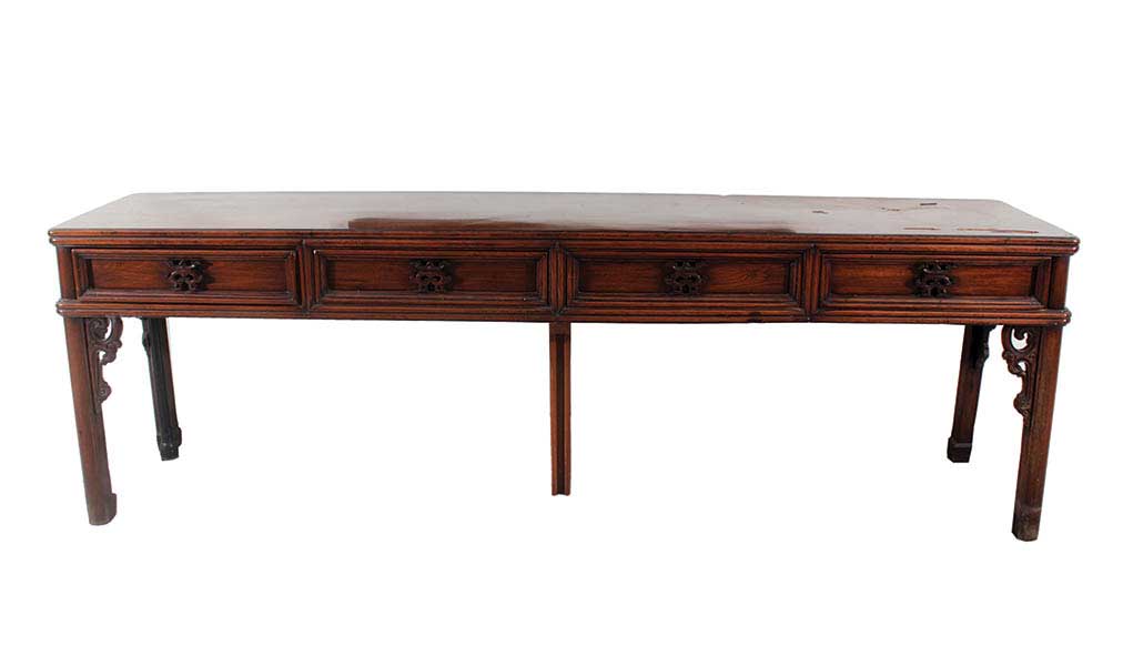 A wooden long side table with four drawers and six legs (see condition)