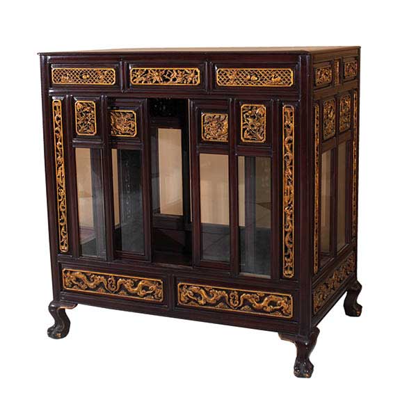 A Chinese display cabinet with gilt panel ornament
