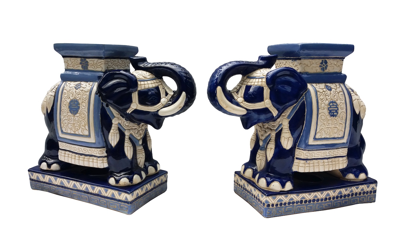 A pair of 20th century Vietnamese blue glazed ceramic model of elephant stands