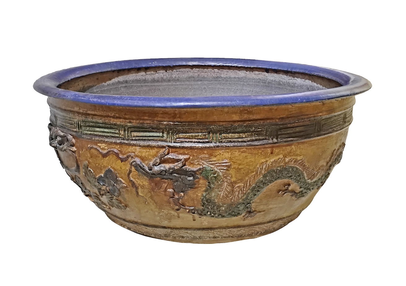 A late qing 19th century Chinese large oval jardiniere decorated with dragons in yellow ochre