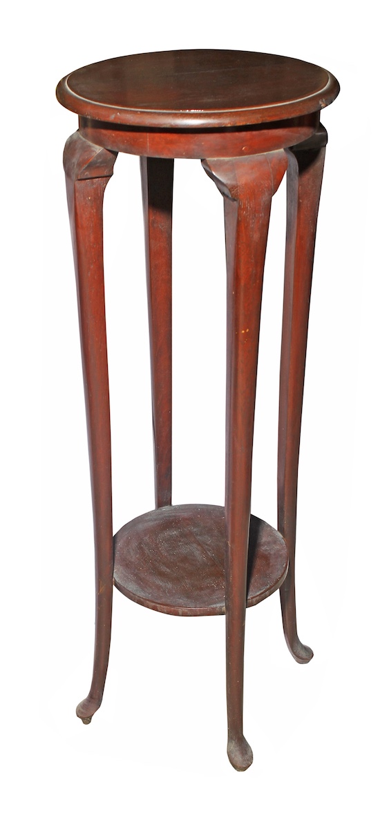 A pair of carved teak stand