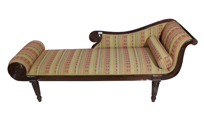 A wooden chaise lounge with modern upholstery.