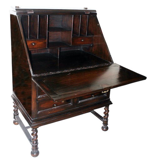 An early 20th century colonial Dutch writing desk with shelved interior with bottom drawers