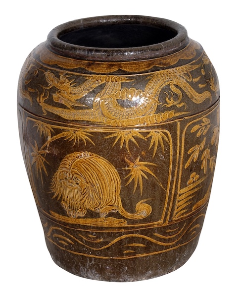 A late qing stoneware storage jar decorated with dragons and birds in yellow ochre