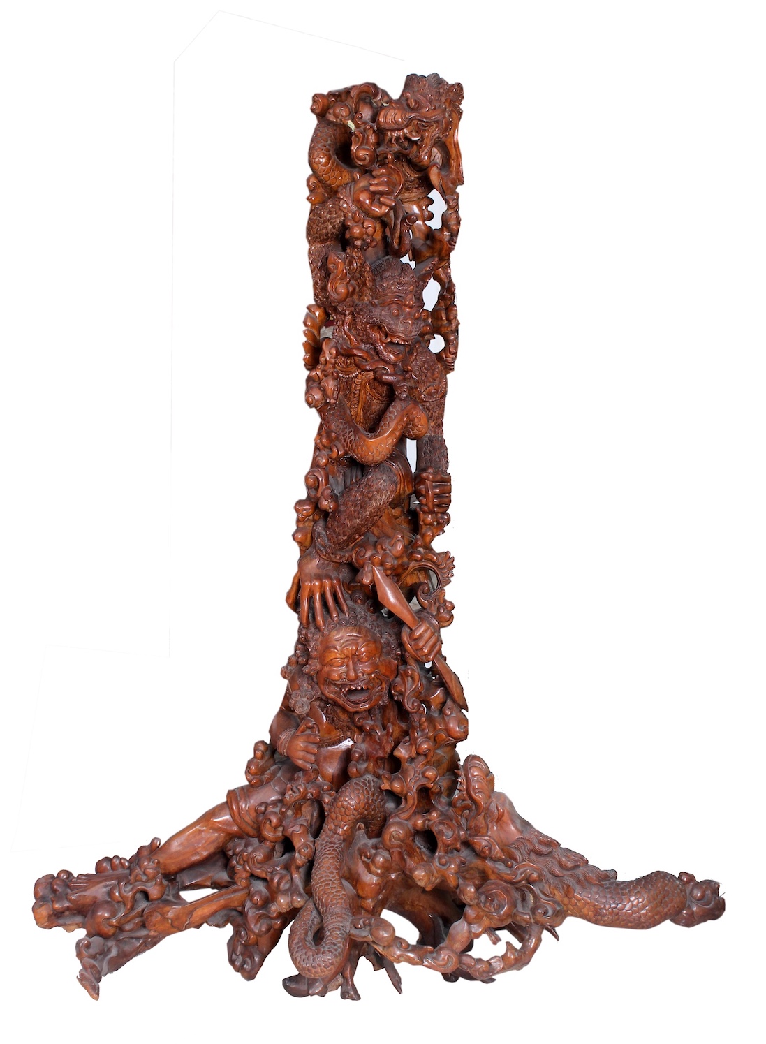 A carved wood tree with figures