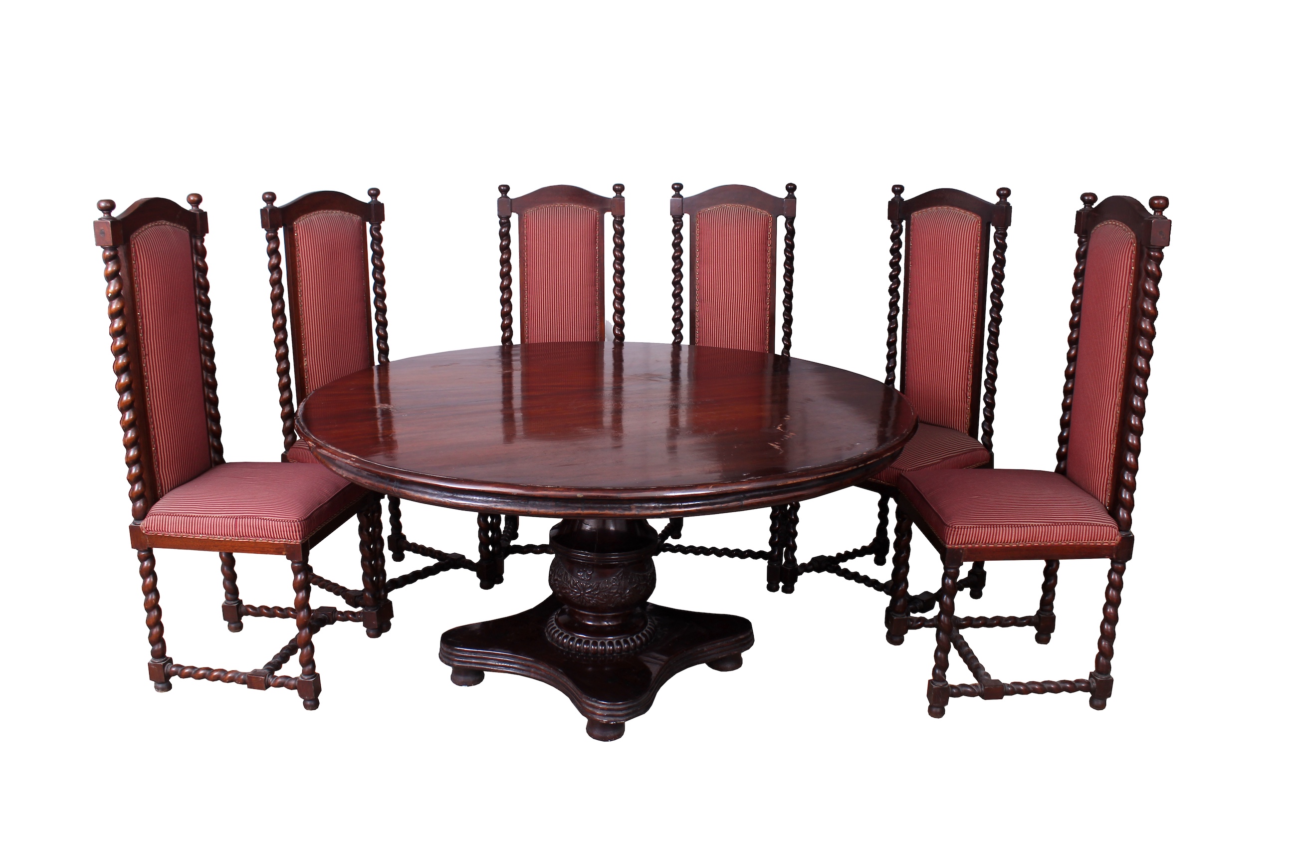 A set of seven of 20th century carved teak dining furniture, consisting of a round table and six red upholstered chairs