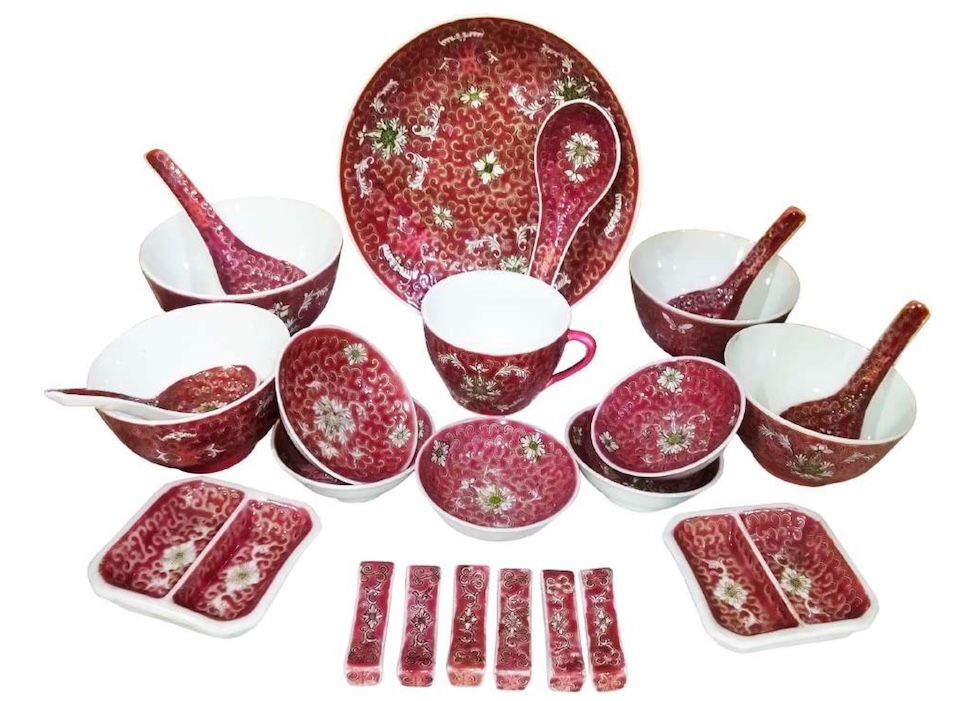 A group of twenty four vintage Chinese ruby ground enamel part circa 1980&rsquo;s consisting of plate, four bowls, five spoons, cup, five sauce plates, two seasoning dip saucer plates, six chopstick