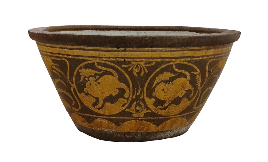 A 19th early 20th century Chinese stoneware oval water jar decorated with yellow ochre panels