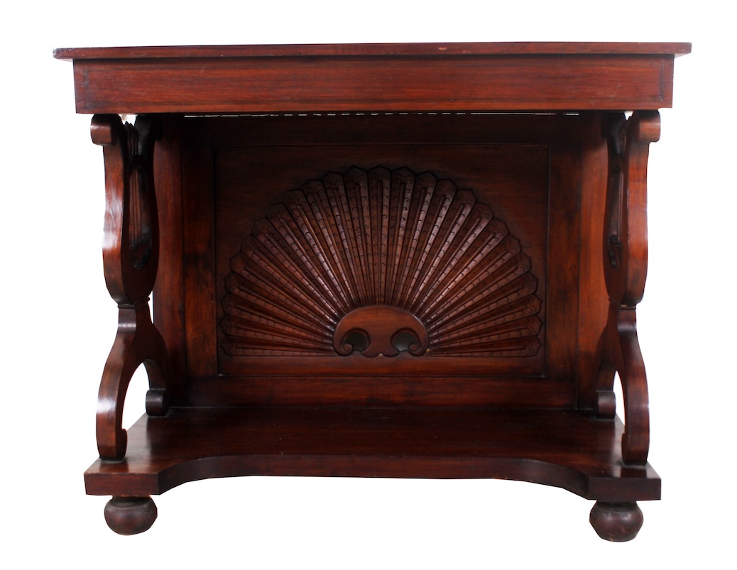 A carved teak side table