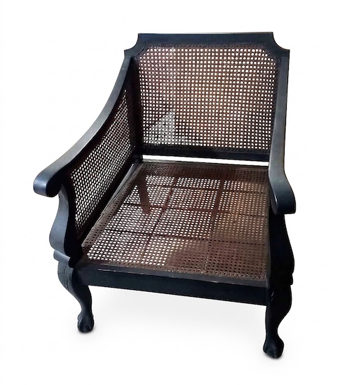 A pair of 19th century carved teak Dutch colonial period armchairs with rattan seat and back