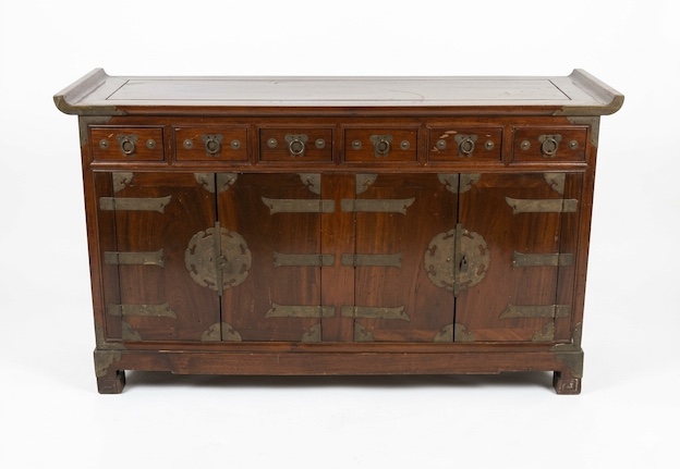 A Korean wooden sideboard with drawers and brass mounts