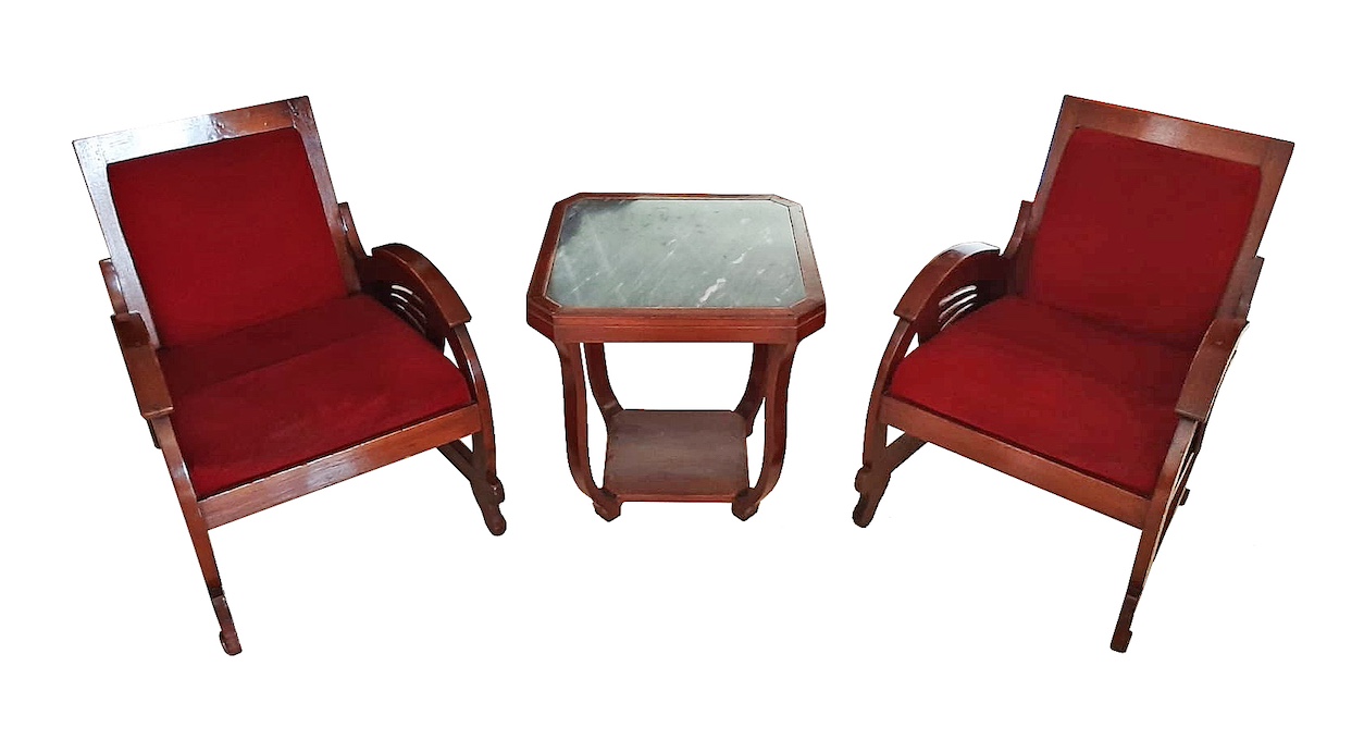 A set of Art Deco living room furniture, consisting of two teak arm chairs and a table circa 1940’s - 1950’s