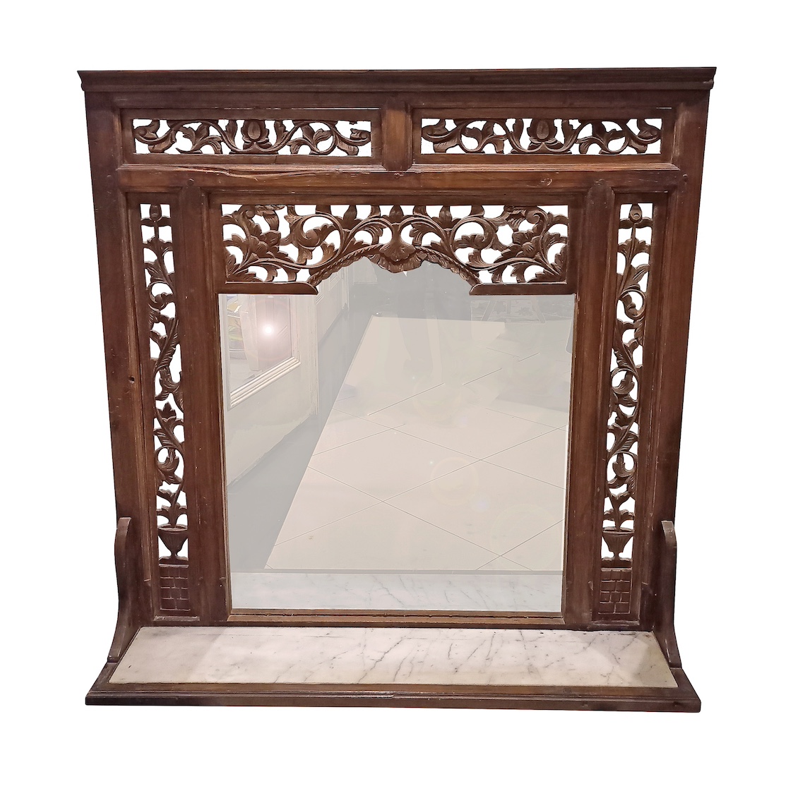 A carved teak wall mirror frame with marble inset