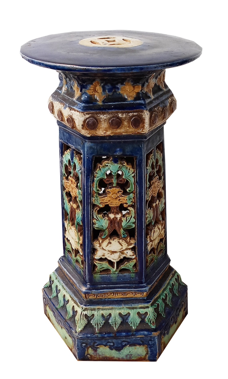 A Late Qing 19th century Chinese Shiwan ceramic pot stand decorated with reticulated polychrome on blue ground