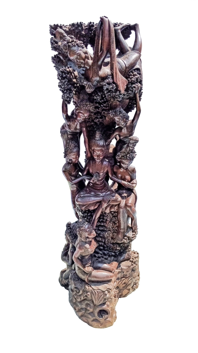 A 20th century carved roots wood group of figures surrounding with meditation seated