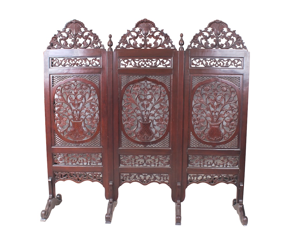 A carved teak floor screen circa 1980&rsquo;s