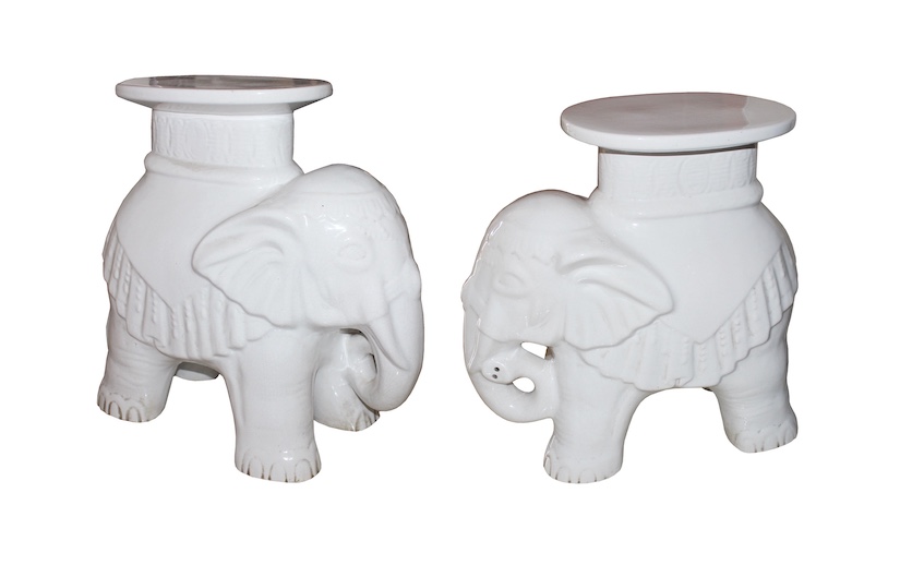 A pair of white glazed ceramic stands model of standing elephants