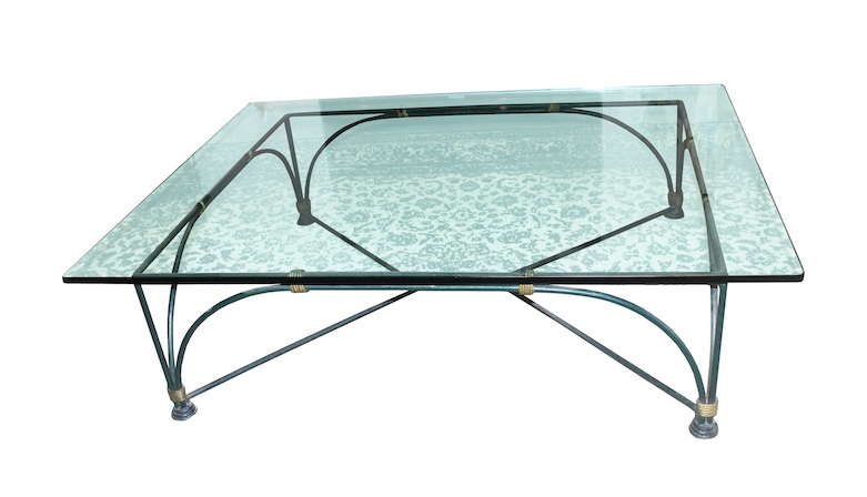 A glass table with iron frame